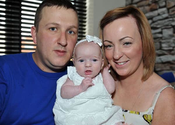 Connie Young (9 weeks) with her Dad David and Mam Helen Dawson. Photograph by FRANK REID