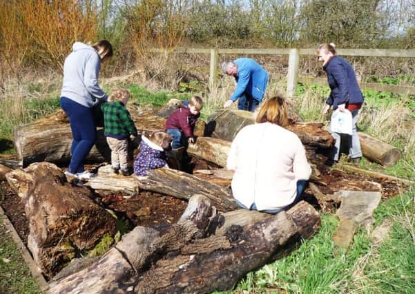Youngsters and their parents enjoying an outdoor activity at Summerhill Country Park.