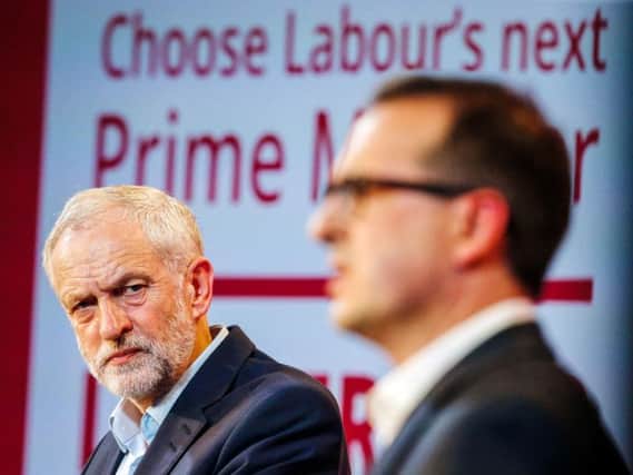 Jeremy Corbyn, left, and Owen Smith take part in a Labour leadership hustings at the Hilton Newcastle Gateshead hotel. Pic: PA.