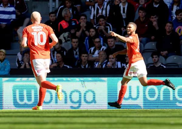 Nahki Wells celebrates firing Huddersfield ahead at Newcastle