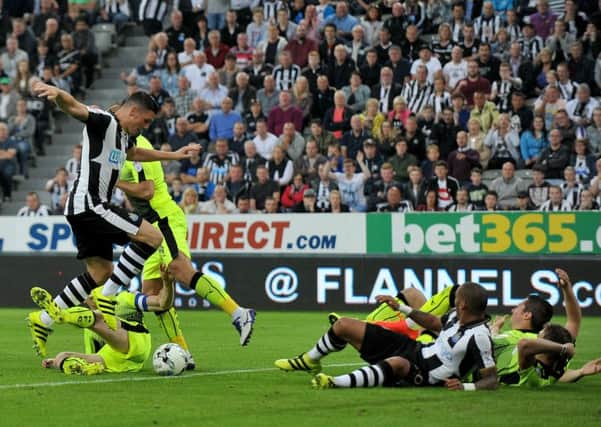Yoan Gouffram is the fall guy after a challenge by Reading's Chris Gunter to earn Newcastle a penalty last night. Picture by Frank Reid