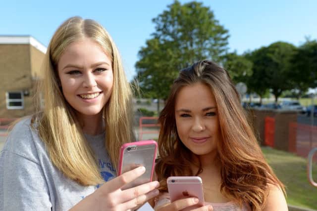 Imogen Joy (left) and Emily Ray from English Martyrs School and Sixth Form College with their results. Picture by FRANK REID