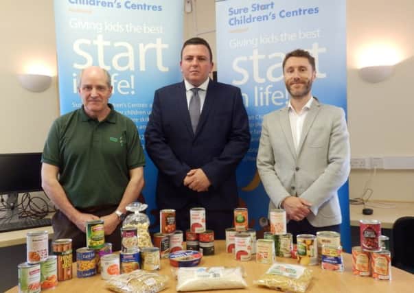 Pictured with a typical food parcel, from left to right, are Clive Hall of Hartlepool Foodbank, Coun Alan Clark and Steven Carter, the councils health improvement practitioner.