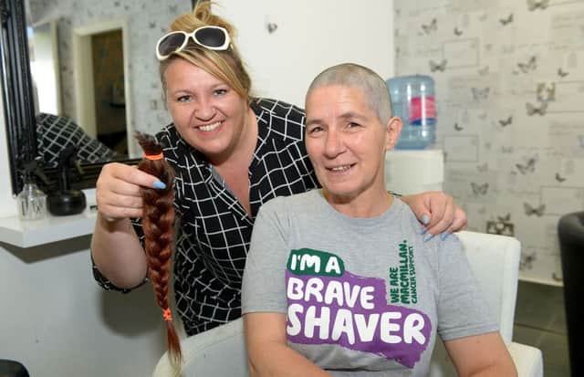 Leo Phis with Tracy Weatherill who shaved her head charity head shave. Picture by FRANK REID