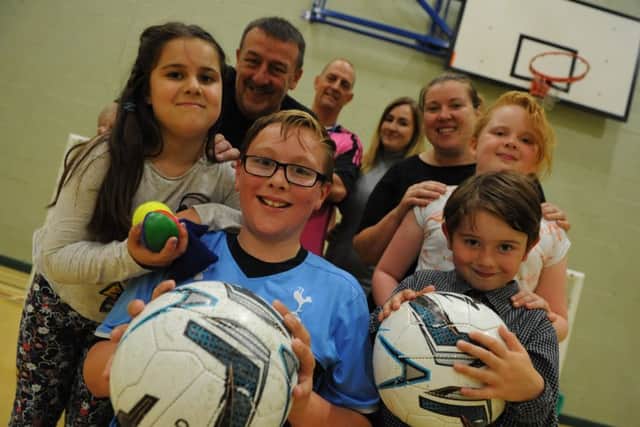 Belle Vue Sports Community Youth Centre's Family Relational activity day, trying out sports are Sophie and Bradley Ashley, Peter Ashley, sports coaches Brian Baines and Claire Ashley, Leanne Naylor with children Amy and Jack.