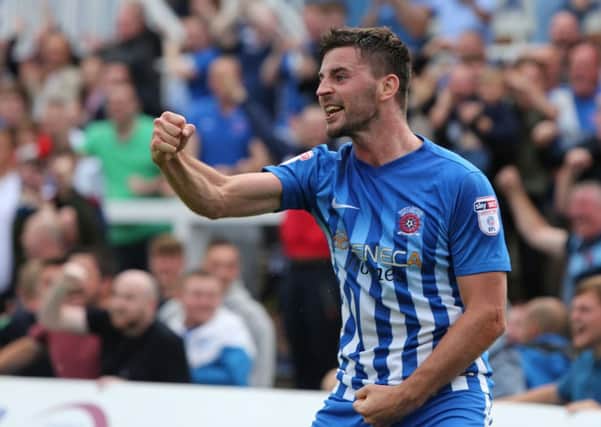 Padraig Amond enjoys his moment after scoring his first home goal for Pools.