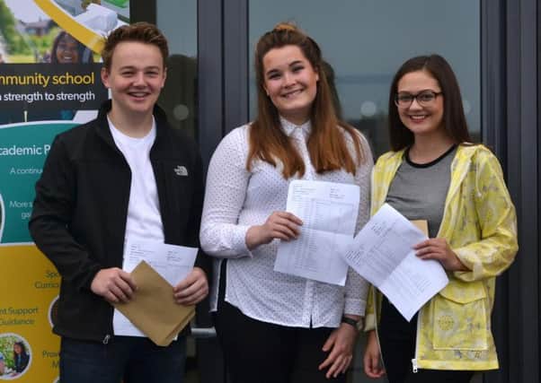 Manor pupils Ben Rutherford, Sarah McKie and Olivia Stanton celebrate their results.