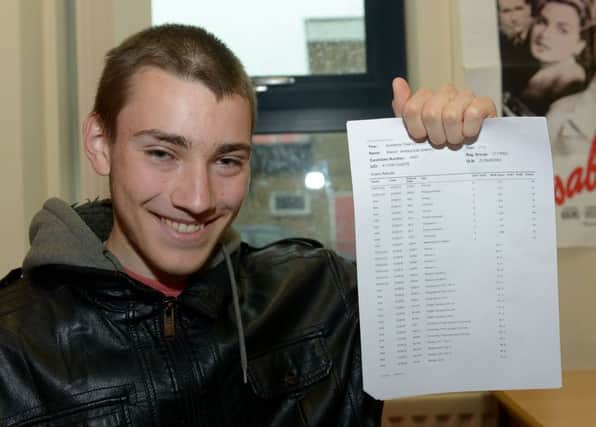 Marcin Antoszczak with his GCSE at English Martyrs School Picture by FRANK REID