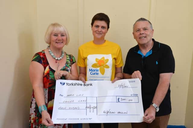 Joan and Ged Hanlon donate funds to Marie Curie's Lisa Wild