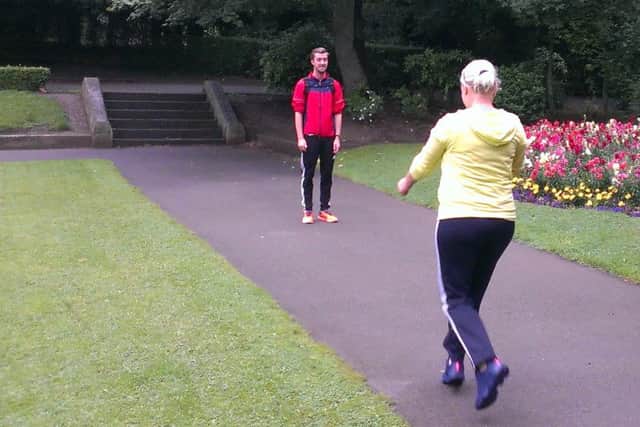 Cath Burgon tries out a warm-up exercise under Matthew's watchful eye.