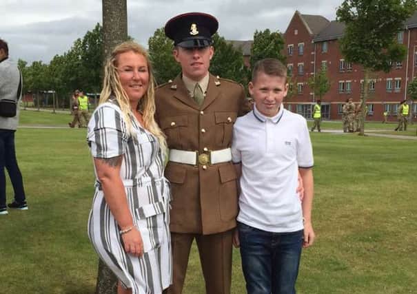 Jordan Sanderson, centre, with mum Vicki Sanderson and brother Kian Ford at Jordan's passing out ceremony