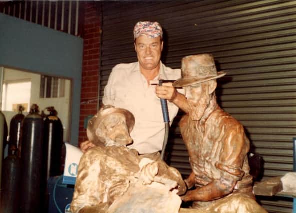 Joe pictured during one of his welding jobs. He restored the statue of Paddy Hannan,  the person who first discovered gold in West Australia about 150 years ago.