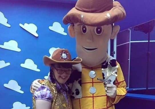 A group member enjoys meeting a favourite character.