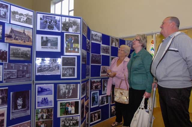 Residents of Hesleden looking a a collection of then and now photographs of the village from the Blackhalls Local History Group at Heseldon Methodist School Room. Pictured from left to right are Sheila Brison, Marlene Margison and Dennis Lowe.