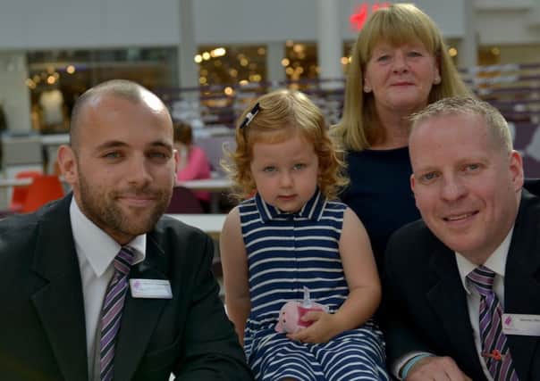 Millie Wise with Middleton Grange Shopping Centre senior security officer Steve Dawking , right, gran Sandra Longmoor and security supervisor Adam Goodwin.