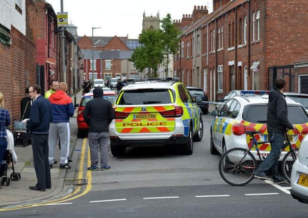 Police in St Oswald's Street.