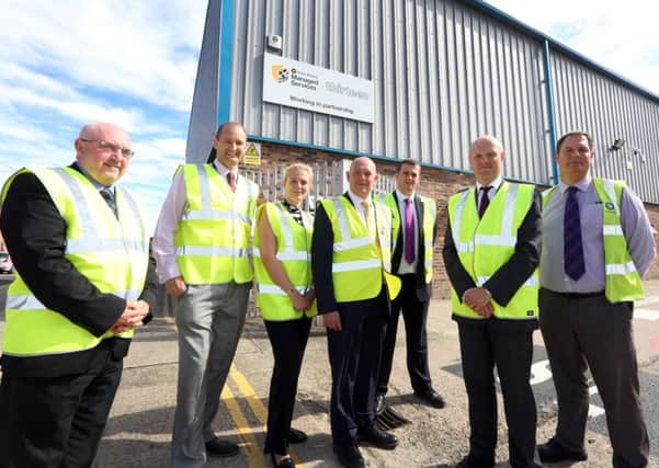 Travis Perkins new stores facilities with Thirteen CEO Ian Wardle and Travis Perkins MD cutting the ribbon to open the building.