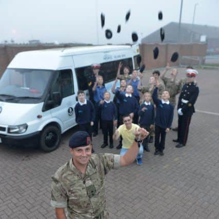Helping Hands handed over the keys to the mini bus to 2nd Lt David Quinn officer in charge Hartlepool Sea Cadets, as cadets look on. Picture by FRANK REID