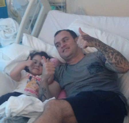 Lyla O'Donovan in hospital with her dad Paul.
