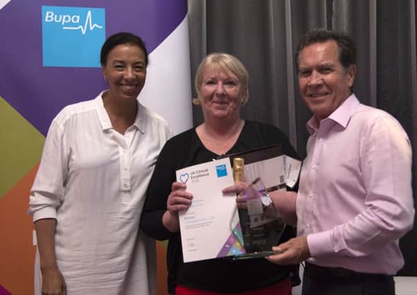 Sandra Blades being presented with a Bupa UK clinical excellence award for compassionate care.