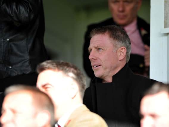 Craig Hignett watches on from the stands.