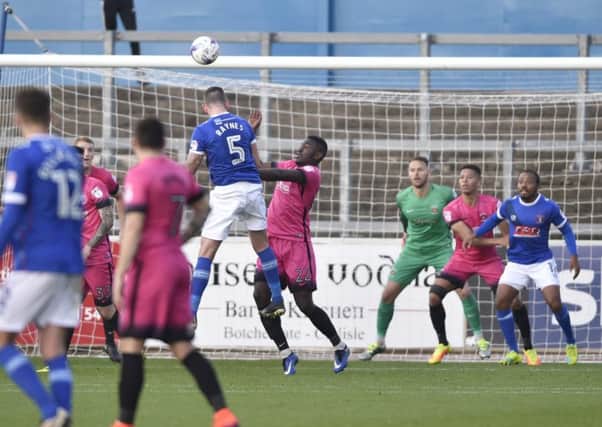 Carlisle's Michael Raynes heads home his side's winning goal
