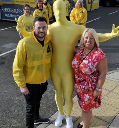 Xercise4less mascot The Colonel with Karl Brown (left) and Suzanne Chaney retail executive Middleton Grange shopping centre and Xercise4less staff. Picture by FRANK REID