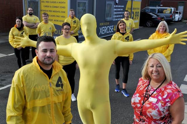 Xercise4less mascot The Colonel with Karl Brown (left) and Suzanne Chaney retail executive Middleton Grange shopping centre and Xercise4less staff. Picture by FRANK REID