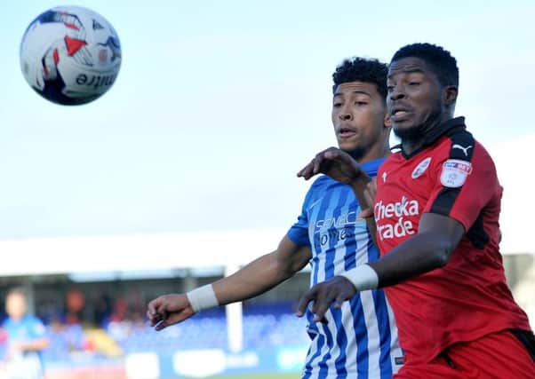 Hartlepool United's Josh Laurent (left) battles against Crawley Town's Andre Blackman. Picture by Frank Reid