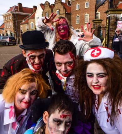 Zombies walk in Hartlepool on Saturday with the proceeds going to Tyler Stokoe (front) pictured with family and orgniser Kate Barrett before the walk.