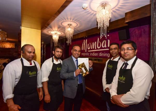 Syed Kalidmiaholid (centre) of Mumbia, Grand Hotel Hartlepool, with some of the staff who have been short listed in the British Curry Awards
