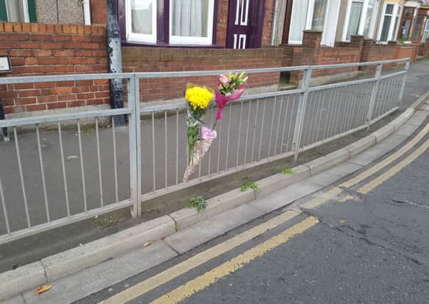 Floral tributes left at the scene of the accident next to the Burn Valley roundabout.