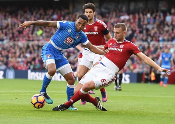 Middlesbrough's Ben Gibson challenges  Bournemouth's Callum Wilson in the recent game