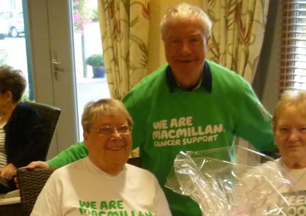 Bryan Langston from Macmillan pictured with representatives of Hartfields.
