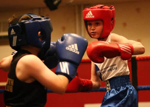 Boxing at Hartlepool Working Men's Club. B. Close, Headland ABC (red) and C Butler, Wearmouth BC (blue). Picture: TOM BANKS
