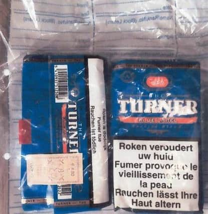The seized cigarettes with a warning in a foreign language.