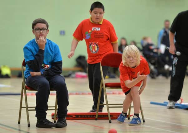 Springwell student Leland Dack competes in boccia