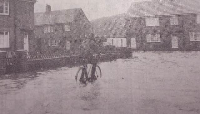 A cyclist presses on with his journey home to Bruntoft Avenue.