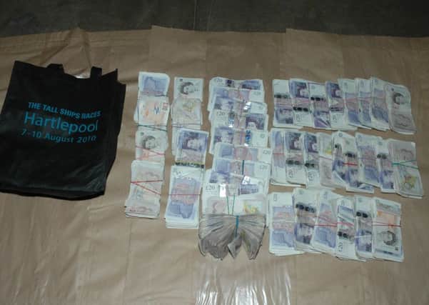 Cash seized by police from the drug dealing operation.