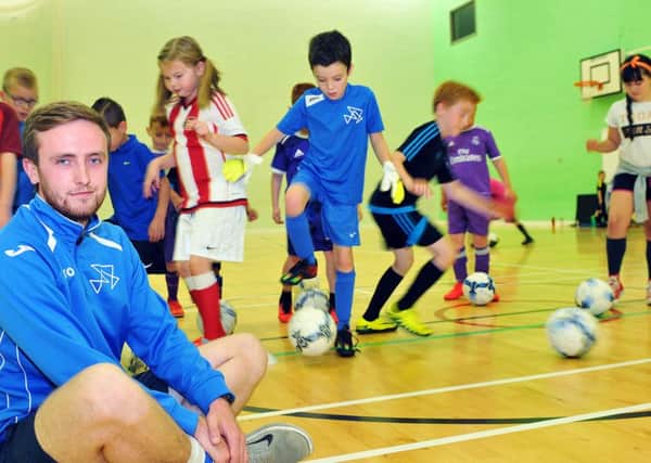 Greg Gavin with members of the Futsal session taking place in the gym at Hartlepool Sixth Form College. Picture by FRANK REID