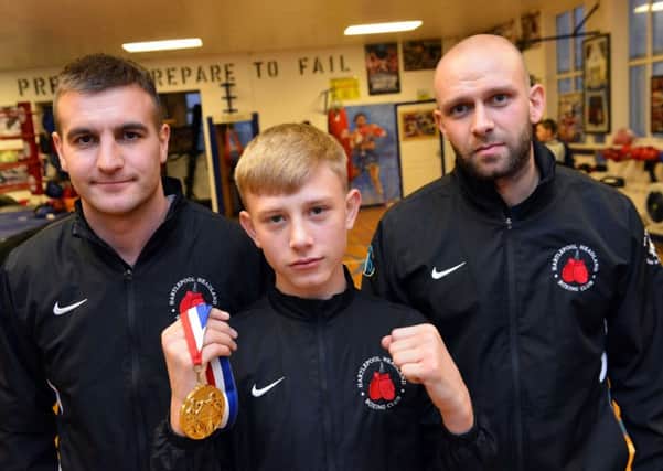 National boxing champion Jordan Brough and coaches from left Andrew Close and John Stubbs