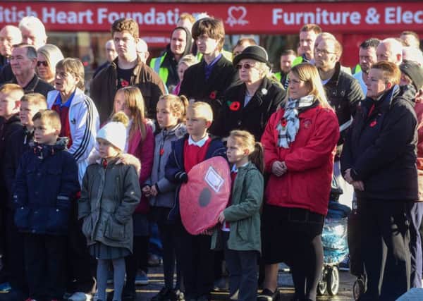 Local school children and members of the public at the Armistice Parade, in Victory Square, Hartlepool.