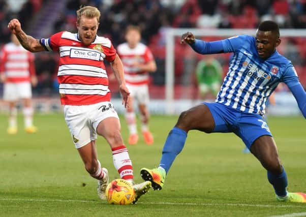 Toto Nsiala challenges Doncaster's Pools old boy James Coppinger