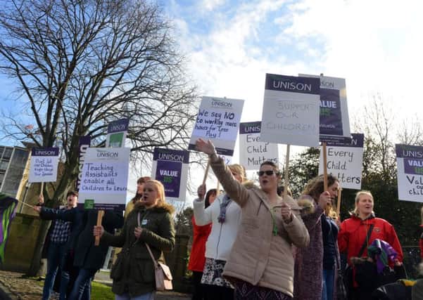 Teaching assistants protest outside the County Hall Durham.