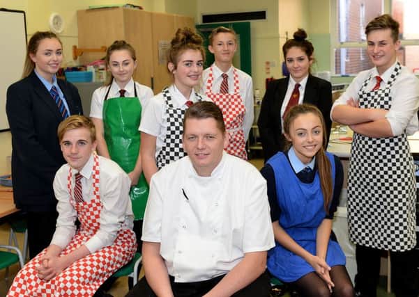 Chef Adam Robson from the St Marys Inn, Stannington with  students to took part in the Catholic Partnership Master Chef event held at English Martyrs School.  Picture by FRANK REID