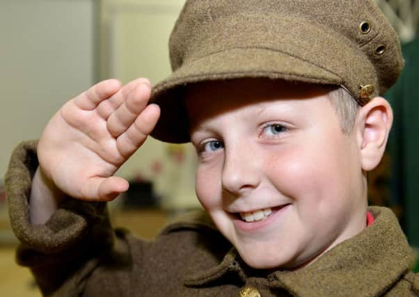 Theo Bradshaw from Hesleden Primary School in one of the many Army uniforms brought into Blackhall Primary School by members of the Blackhall History Group.  Picture by FRANK REID