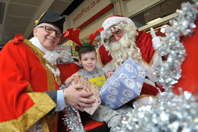 From left to right, the ceremonial Mayor of Hartlepool, Coun Rob Cook, with Alfie Smith and Santa Claus.