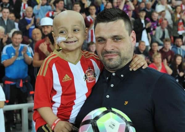Bradley Lowery with dad Carl when he was mascot at the Sunderland v Everton game