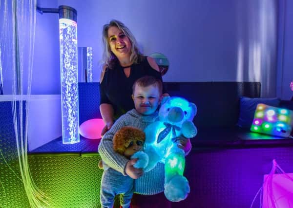 Lucas Jeffries (4) with Barbara Ward of Be Crafty. The Arches, Park Road, Hartlepool, in their new sensory room that was officially opened by Lucas on Saturday.
