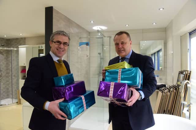 Business Director at MKM Building Supplies, Burn Road, Hartlepool, Lee Dees (left) and Mick Sumpter (right)  launch their Give a Little Gift Christmas Appeal.